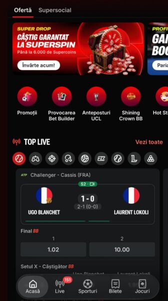 Superbet, ecran Ofertă cu promoția Super Drop SuperSpin, câștig garantat de până la 6.000 Supercoins, buton „Învârte acum” și secțiune Top Live pentru pariuri sportive